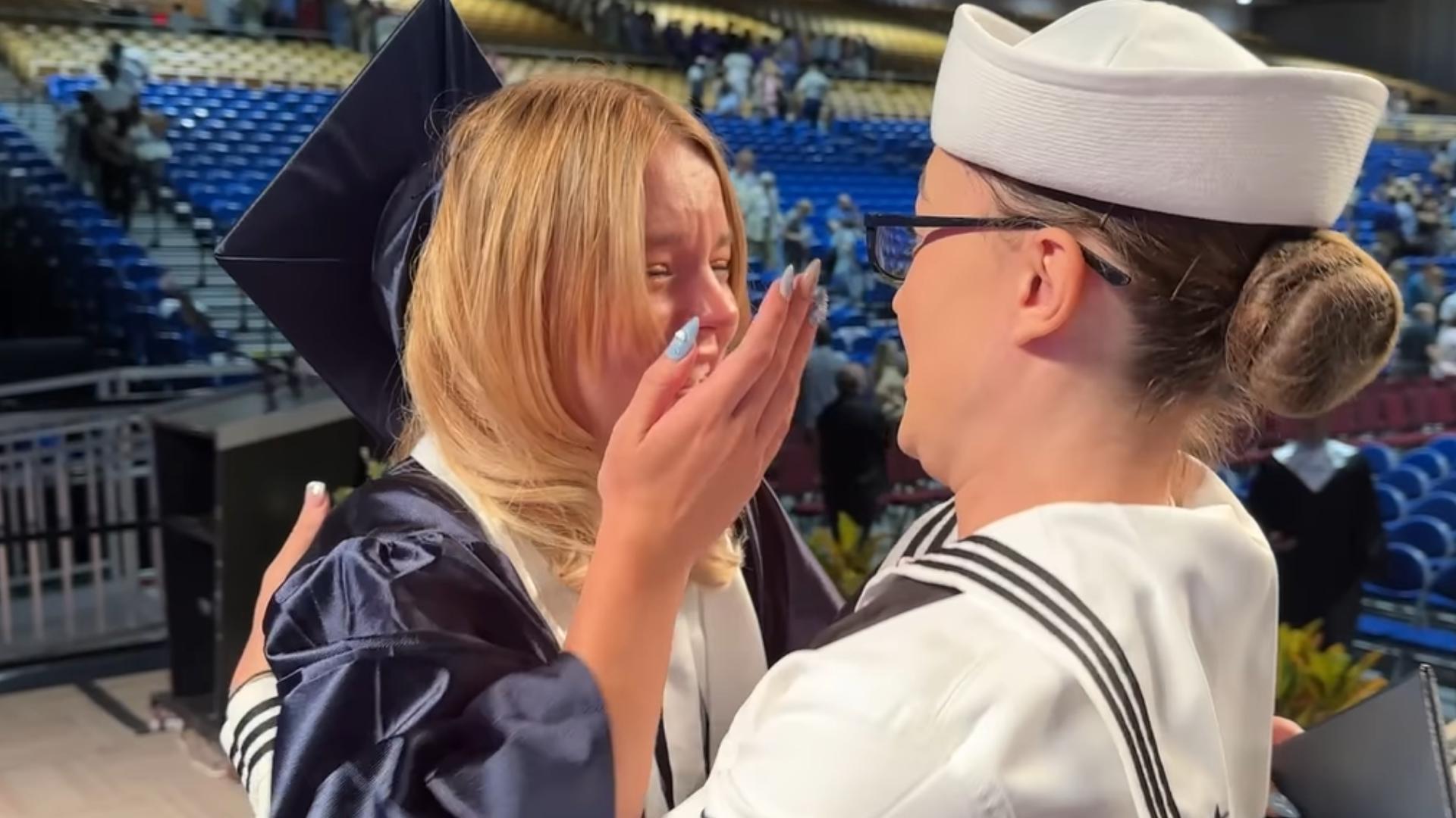 Newsome High School grad Faith Brown choked back tears as her sister came out to greet her on her special day.