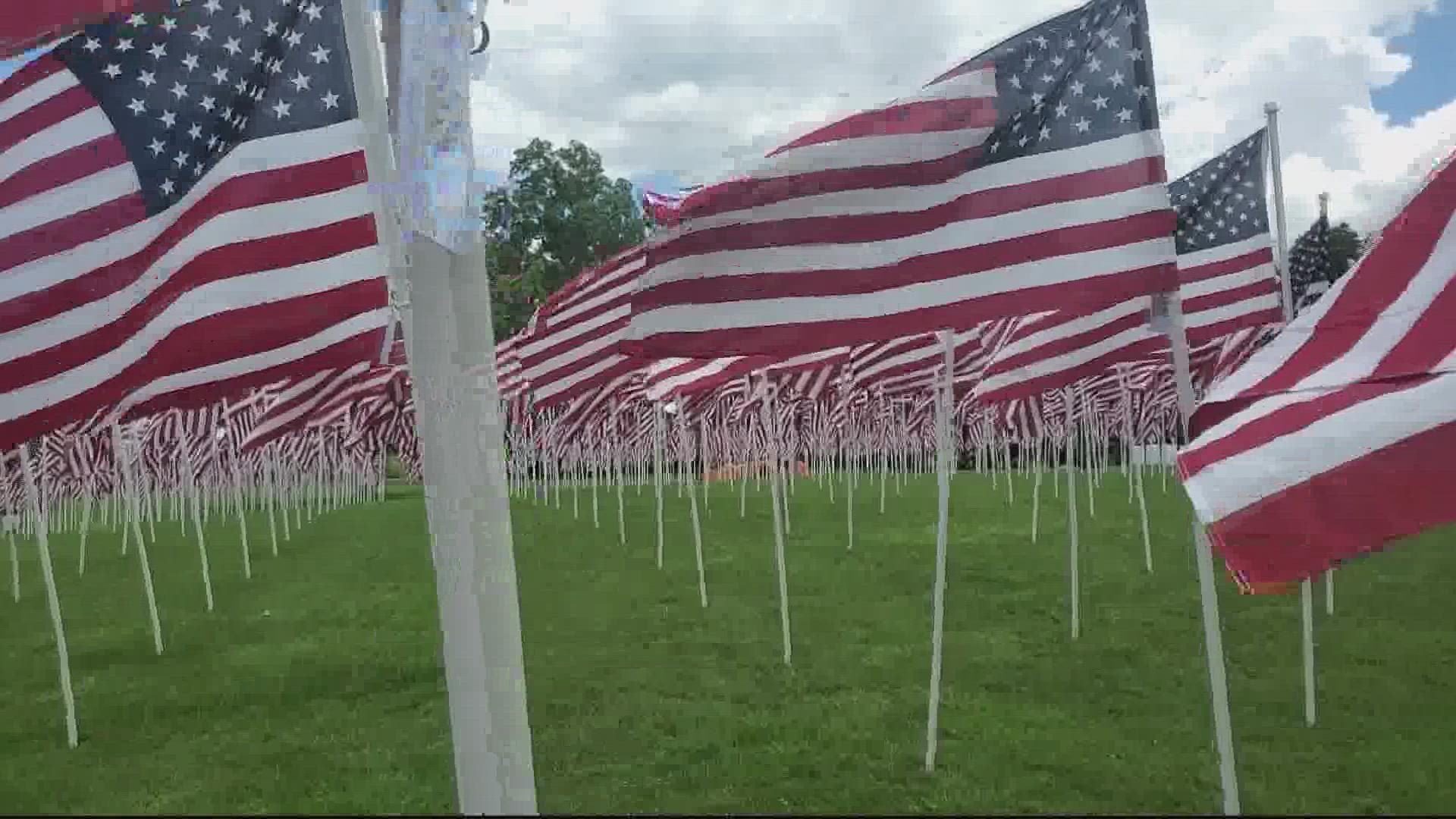 The flags are laid out for Memorial Day as the tradition organized by the Rotary Club of Montgomery Village. Every flag has a name of a person who died for USA.